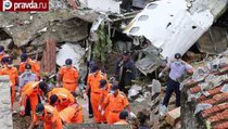 В Тайване самолёт упал на жилые дома: более 50 погибших 